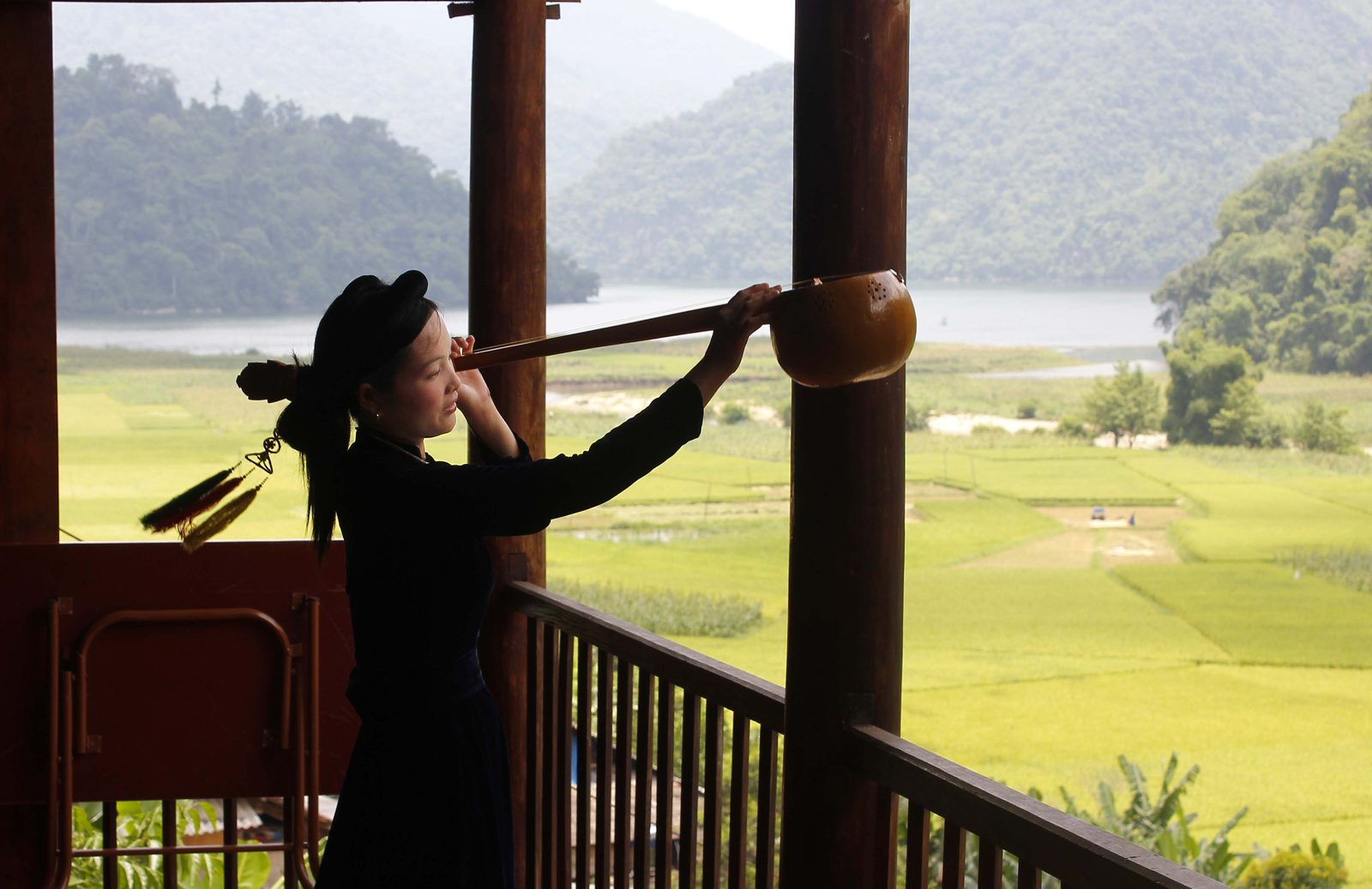 Then singing on a stilt-house porch above rice fields and Ba Be Lake