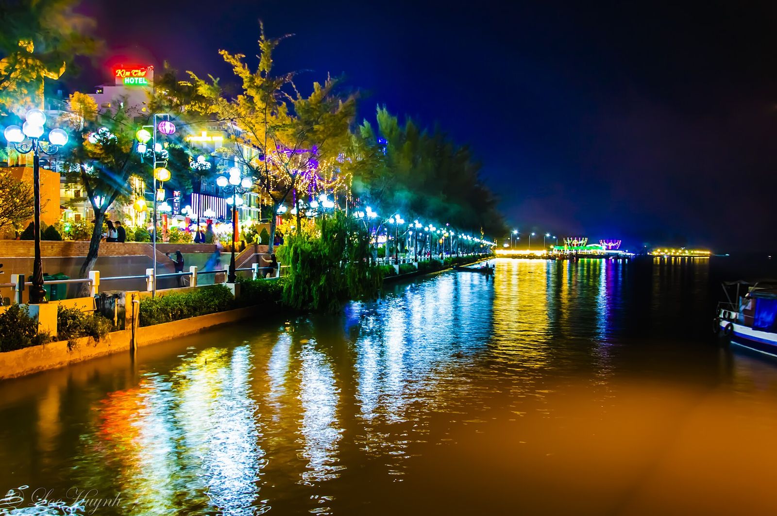 Ninh Kieu wharf in Can Tho at night, with colored lights reflected in the river