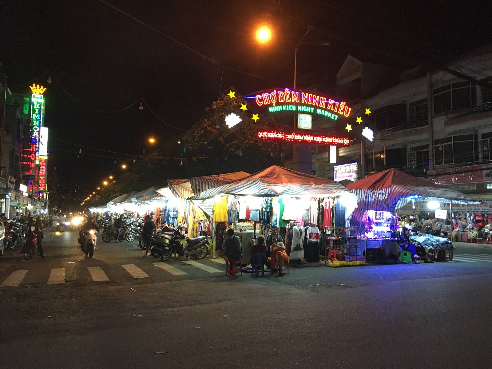 Clothing and souvenir stalls lit up at the Ninh Kieu night market in Can Tho