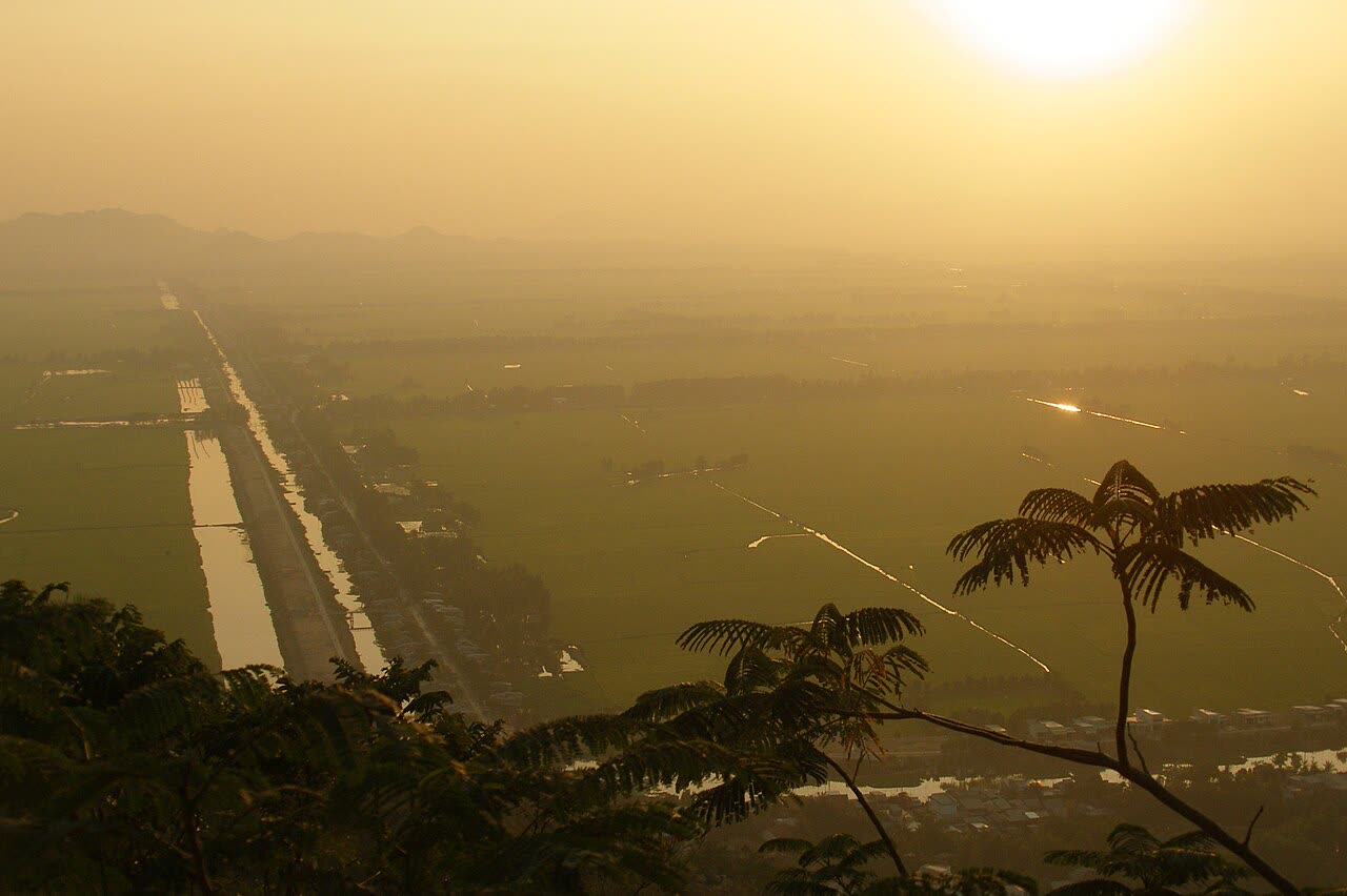 Sunset view from Sam Mountain over canals and fields near Chau Doc