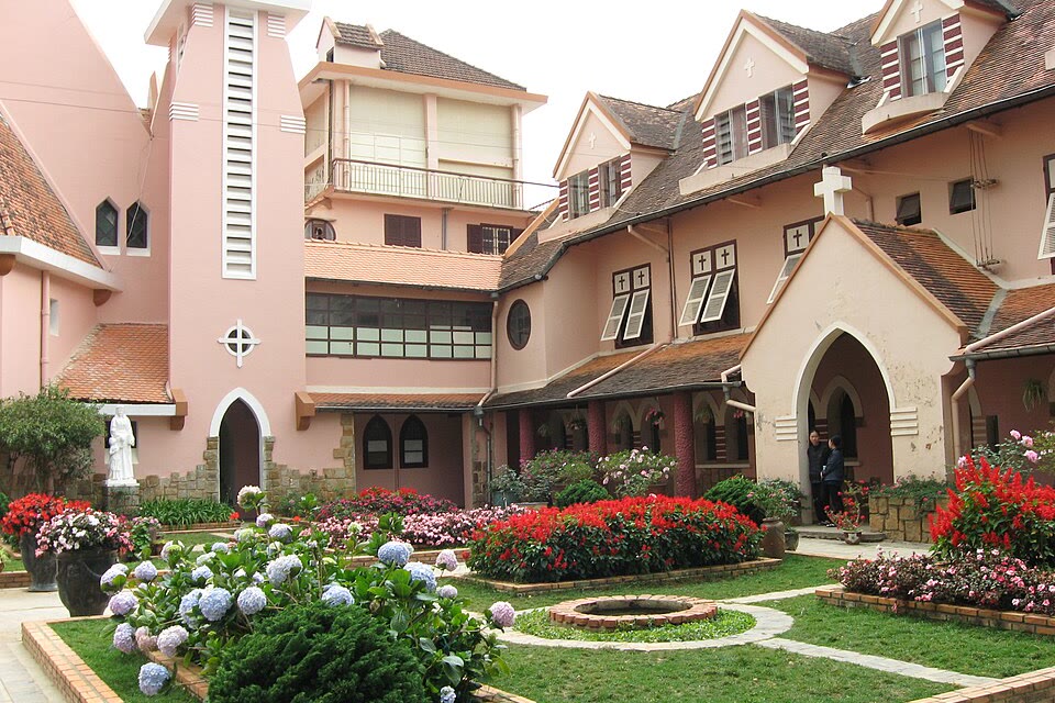 Courtyard and pink church at Domaine de Marie in Da Lat