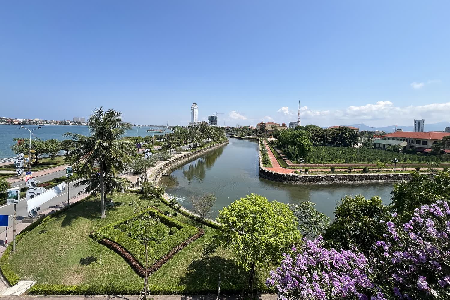 A corner of the old Đồng Hới walls with water and a garden
