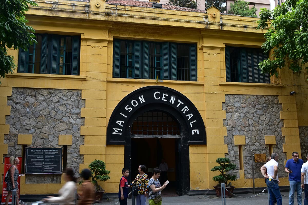 Visitors at the Hoa Lo prison gate in Hanoi