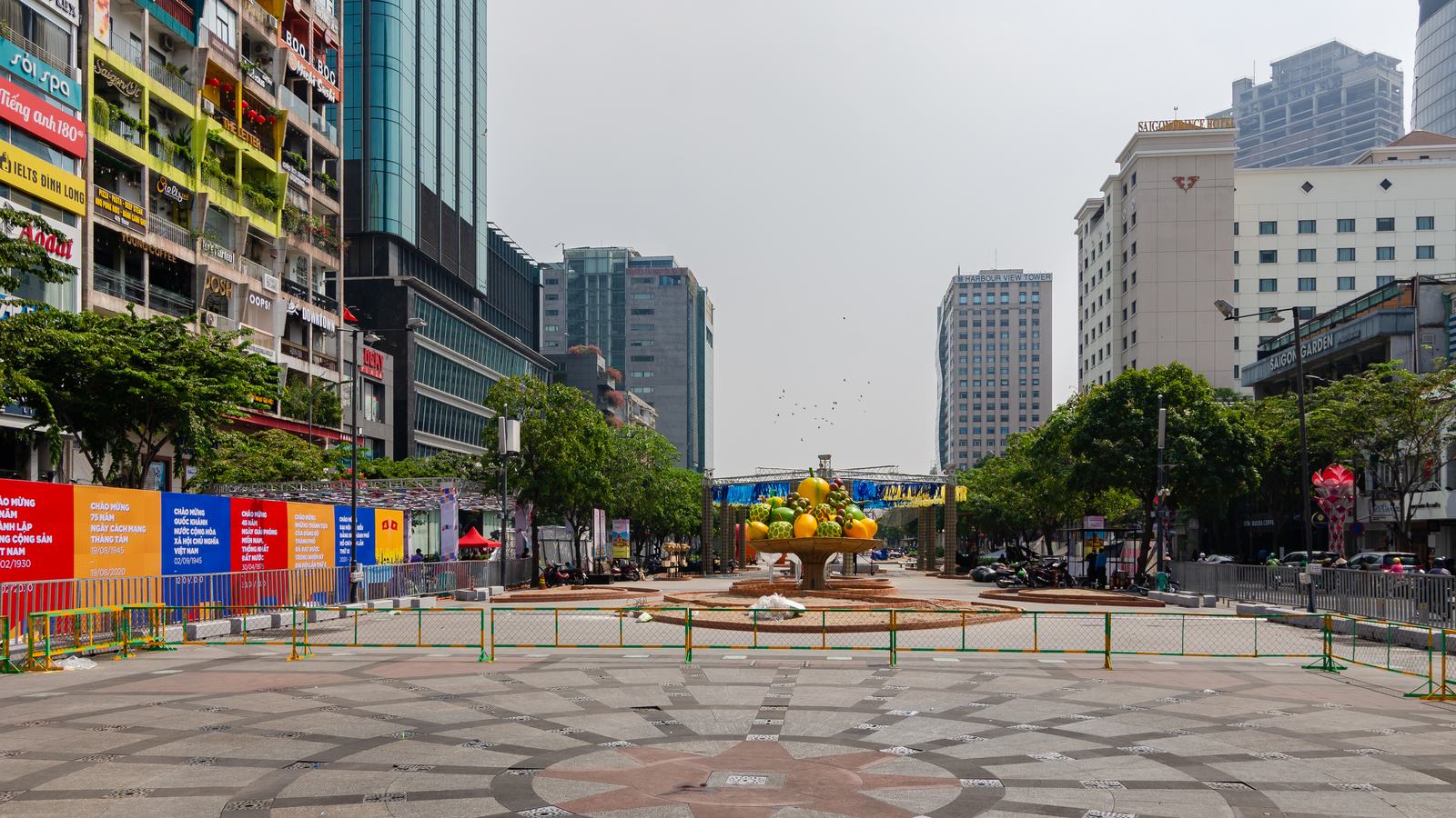 Nguyen Hue walking street in daylight, paving and towers