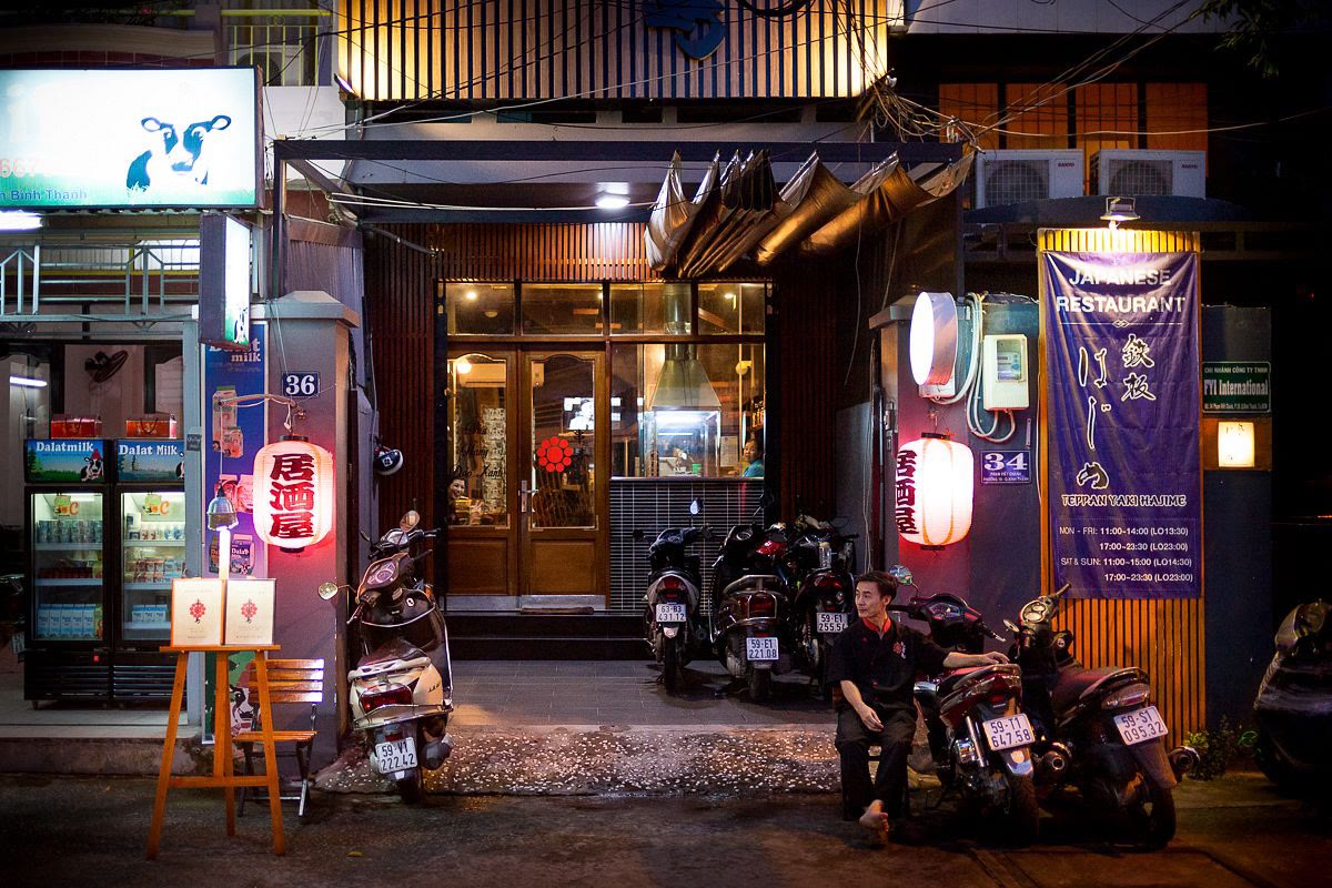 Japanese restaurant fronts at night on Phạm Viết Chánh, including 34 and 36