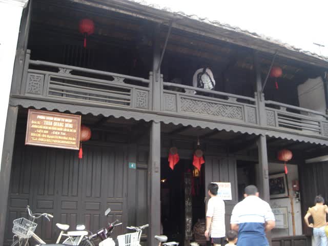 The timber balcony and the doorway at number 4