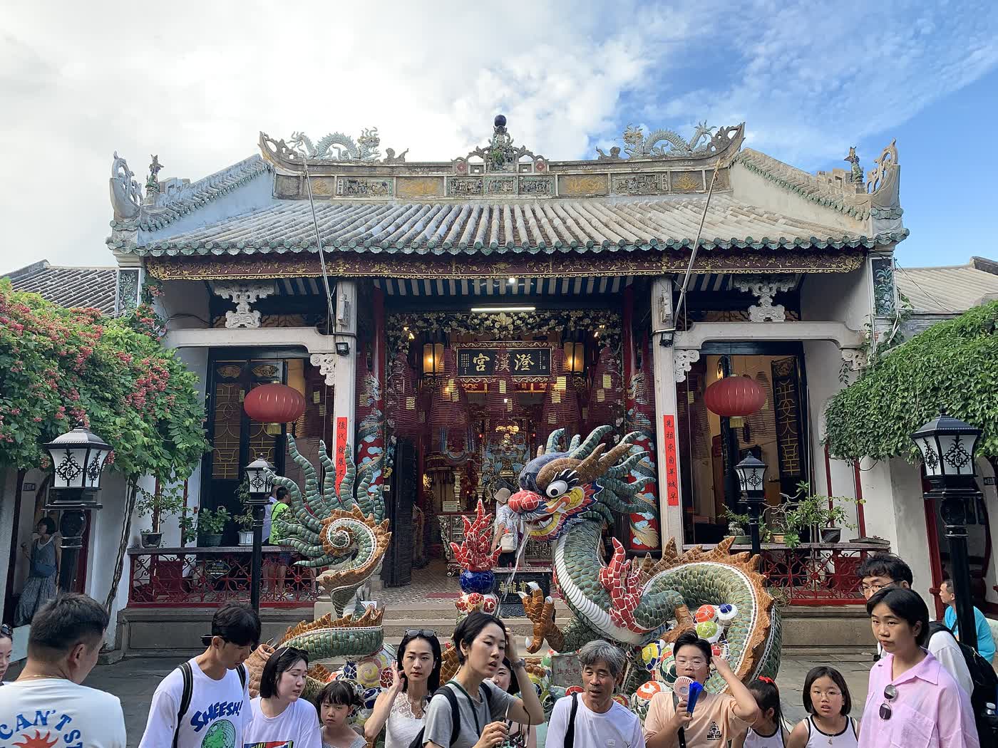 The tiled hall of the Cantonese Assembly Hall in Hoi An, with a ceramic dragon in front