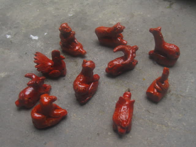 Small red terracotta animal figures made in Thanh Ha pottery village