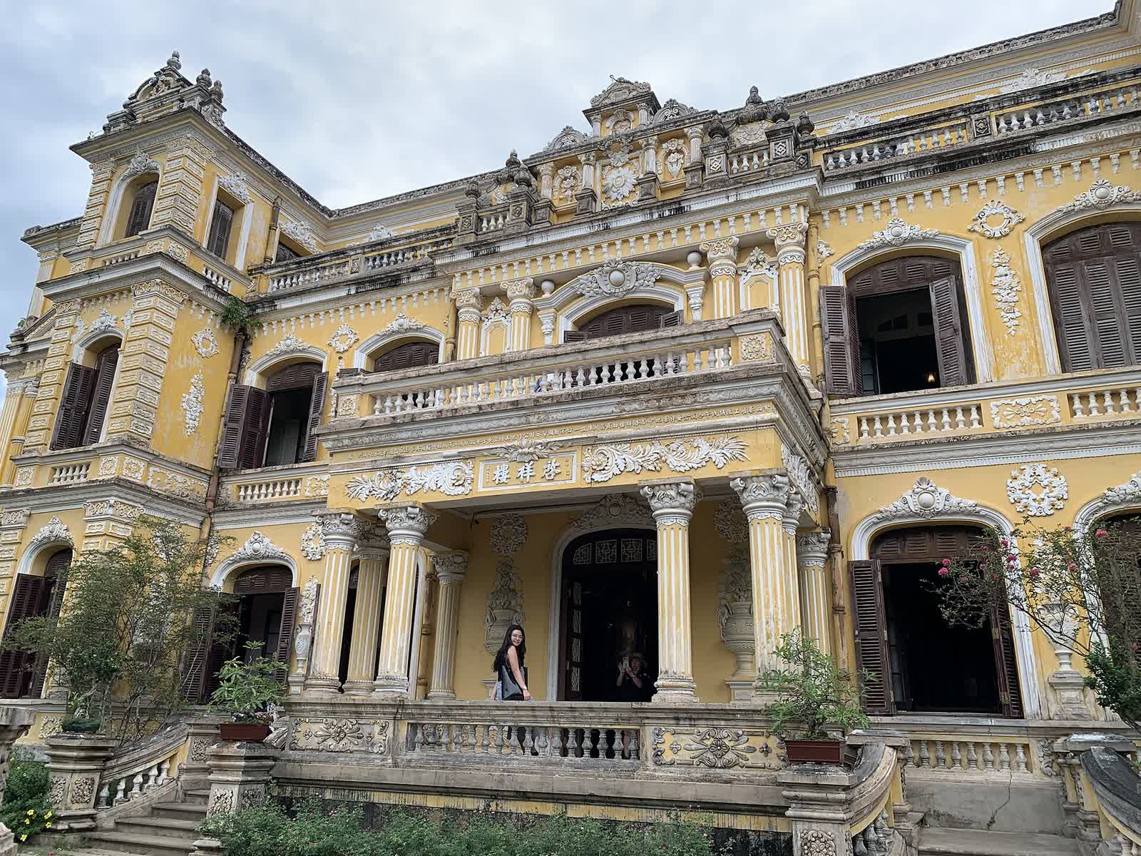 The yellow facade of Khải Tường tower at An Dinh