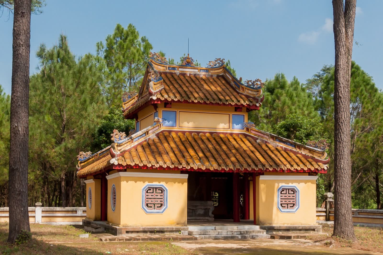 A yellow pavilion among the pines at Gia Long’s tomb
