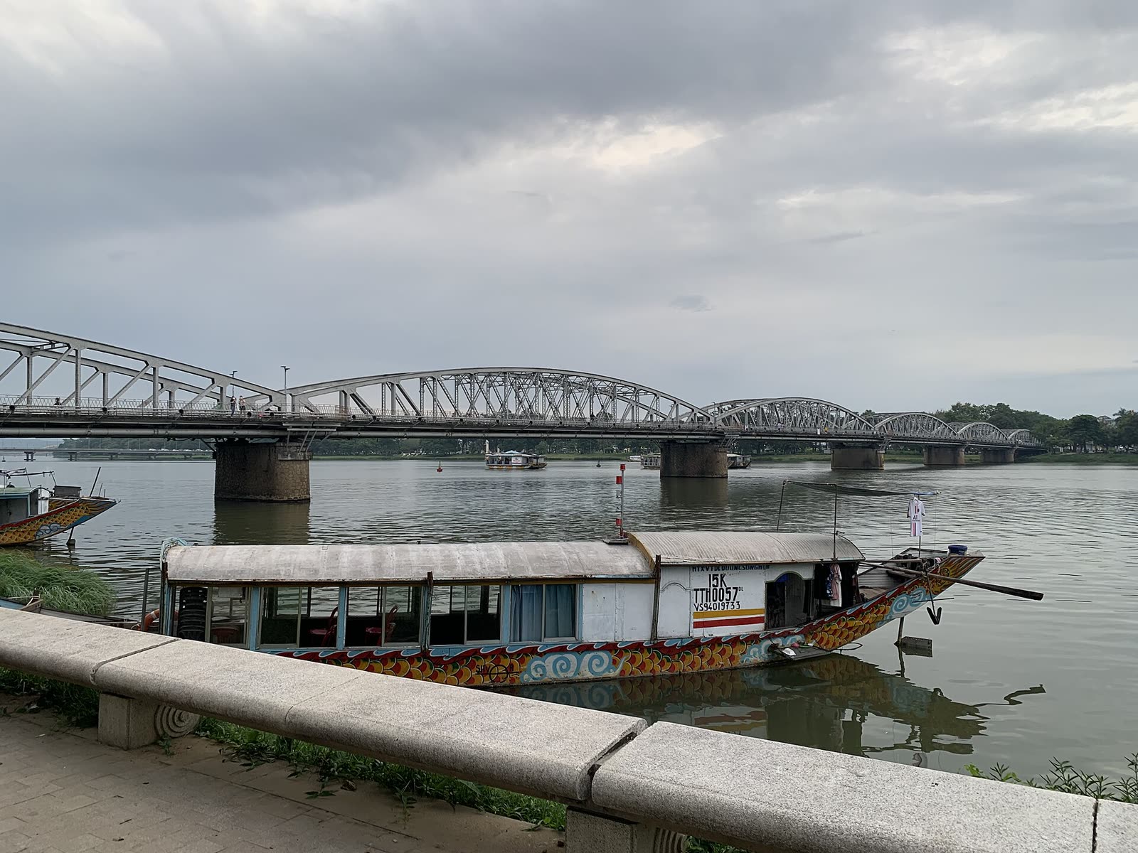 A painted boat on the Perfume River beside Truong Tien Bridge