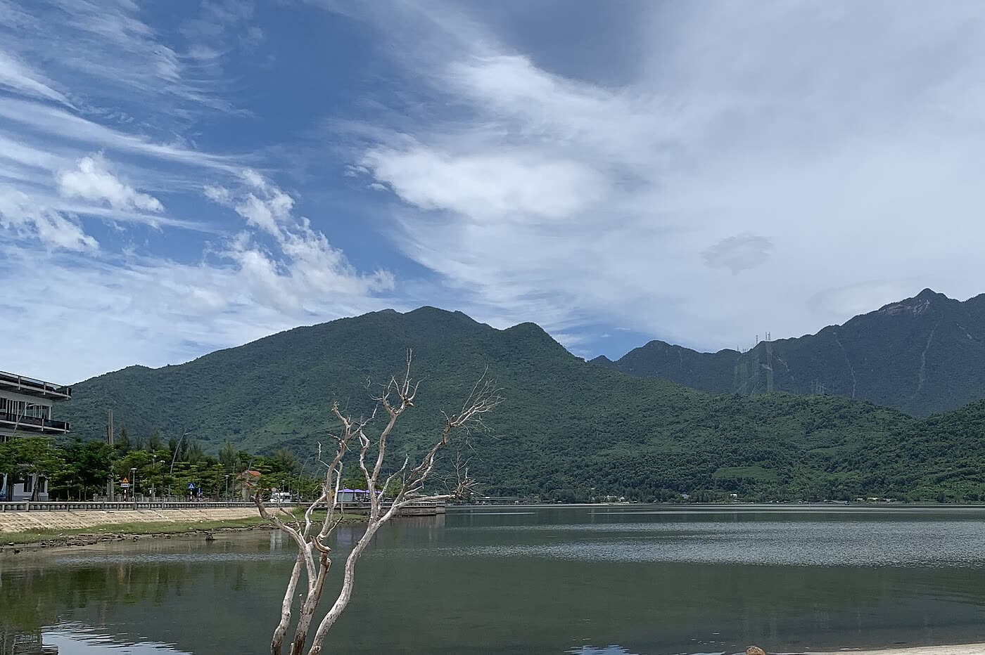 Lap An lagoon with forested mountains behind the far shore