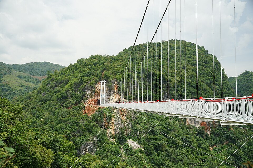 The glass span and the hill behind it