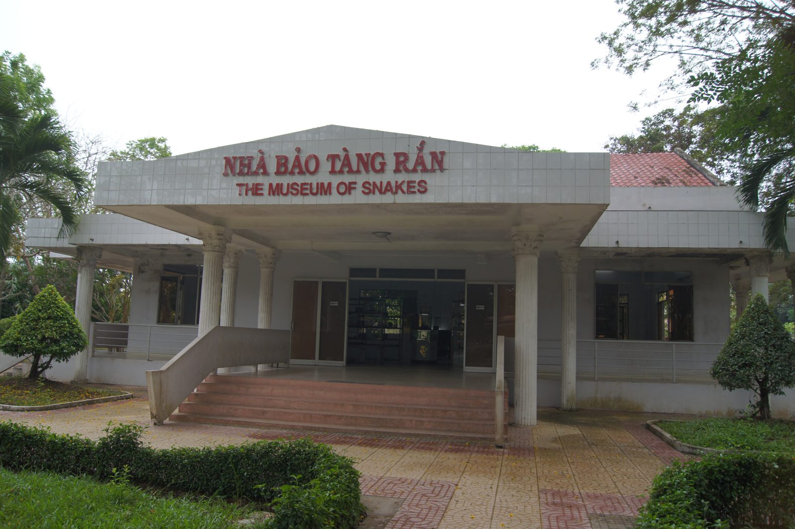 The white snake museum at Dong Tam, with columns and a tiled approach