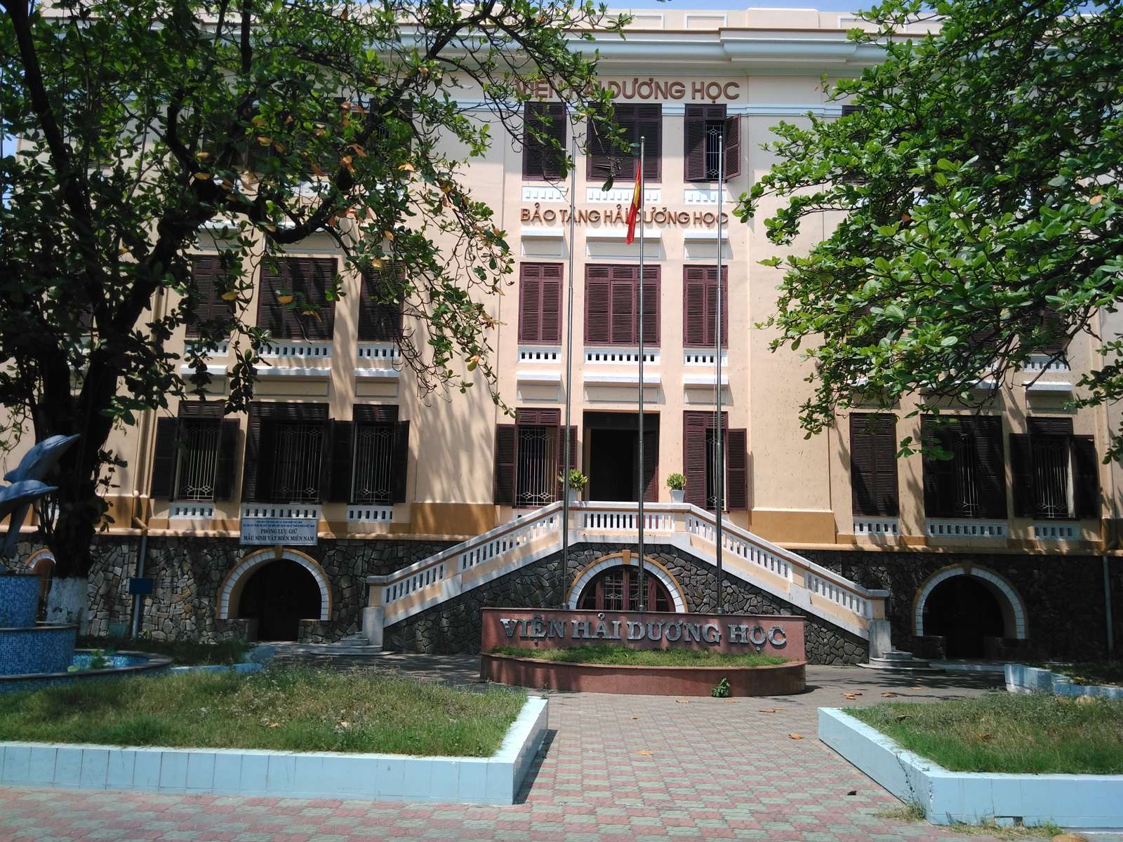 The front of the Institute of Oceanography in Nha Trang, with the museum sign above the door