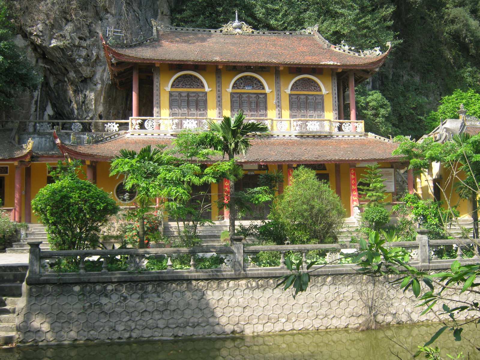 The yellow pagoda against the cliff at Dich Long