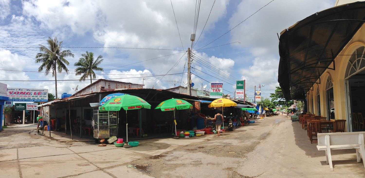 Market stalls and umbrellas along the street in Ham Ninh, Phu Quoc