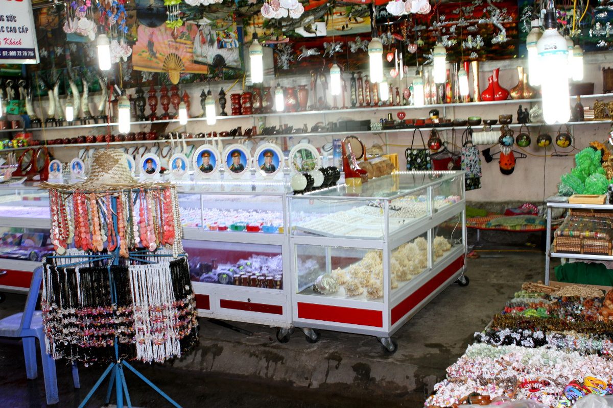 Beads, shells, and display cases at a stall in Dinh Cau Night Market
