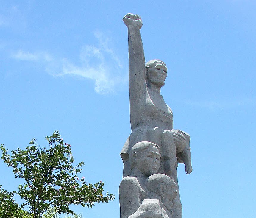 Close view of the Son My memorial statue, the raised fist and the figures below it