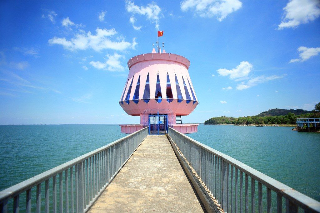 A pink tower at the end of a pier on Dau Tieng Lake